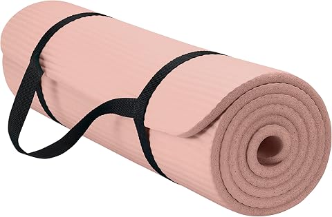 GAIAM Thick Exercise Mat, Cushioned Non-Slip Yoga & Pilates rolled in light pink with a portable sling, designed for anti fatigue Floor exercises, matting, pilates, stretching, and Yoga.