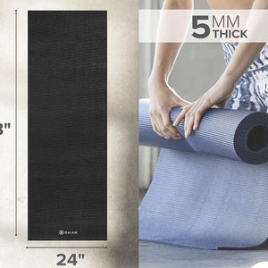 Yoga mat with dimensions and thickness information, featuring a Gaiam brand logo.