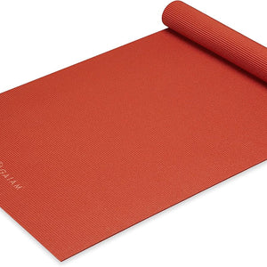 Gaiam Classic Solid Color Yoga Pilates Mat 5mm Sunburnt rolled angled view