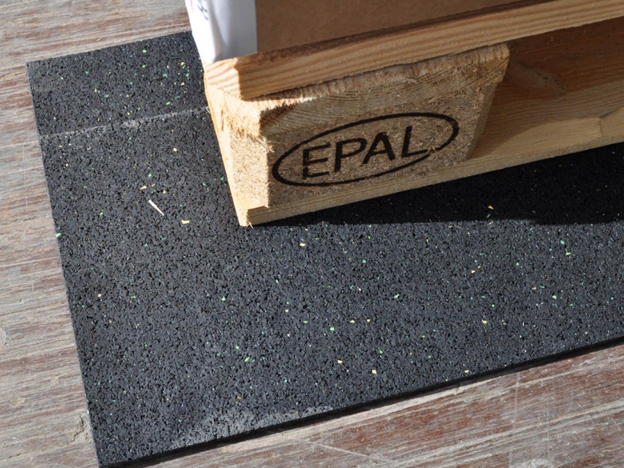 FitFloors.com Anti Slip Rubber Mat Confetti Underlayment For Floor Protection And Traction used beneath an EPAL wooden pallet to protect the floor and improve stability.