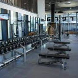 Commercial gym with interlocking rubber gym tiles high impact installed wall to wall