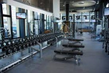 Commercial gym with interlocking rubber gym tiles high impact installed wall to wall