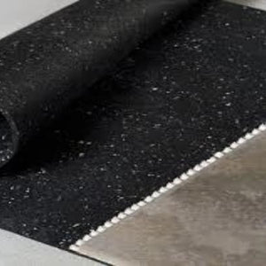 Rubber underlayment flooring roll close-up edge detail showing thickness profile