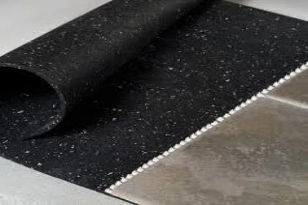 Rubber underlayment flooring roll close-up edge detail showing thickness profile
